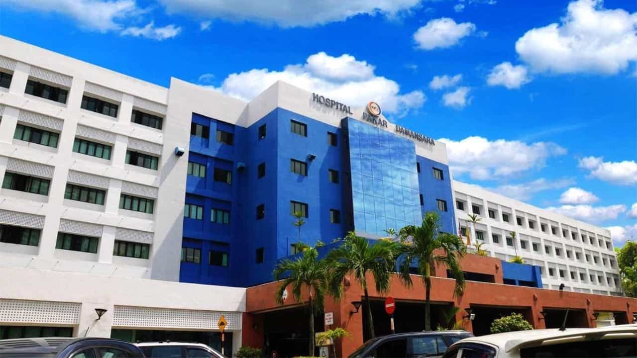 The exterior of KPJ Damansara Specialist Hospital, a blue and white building on Jalan SS 20/10.